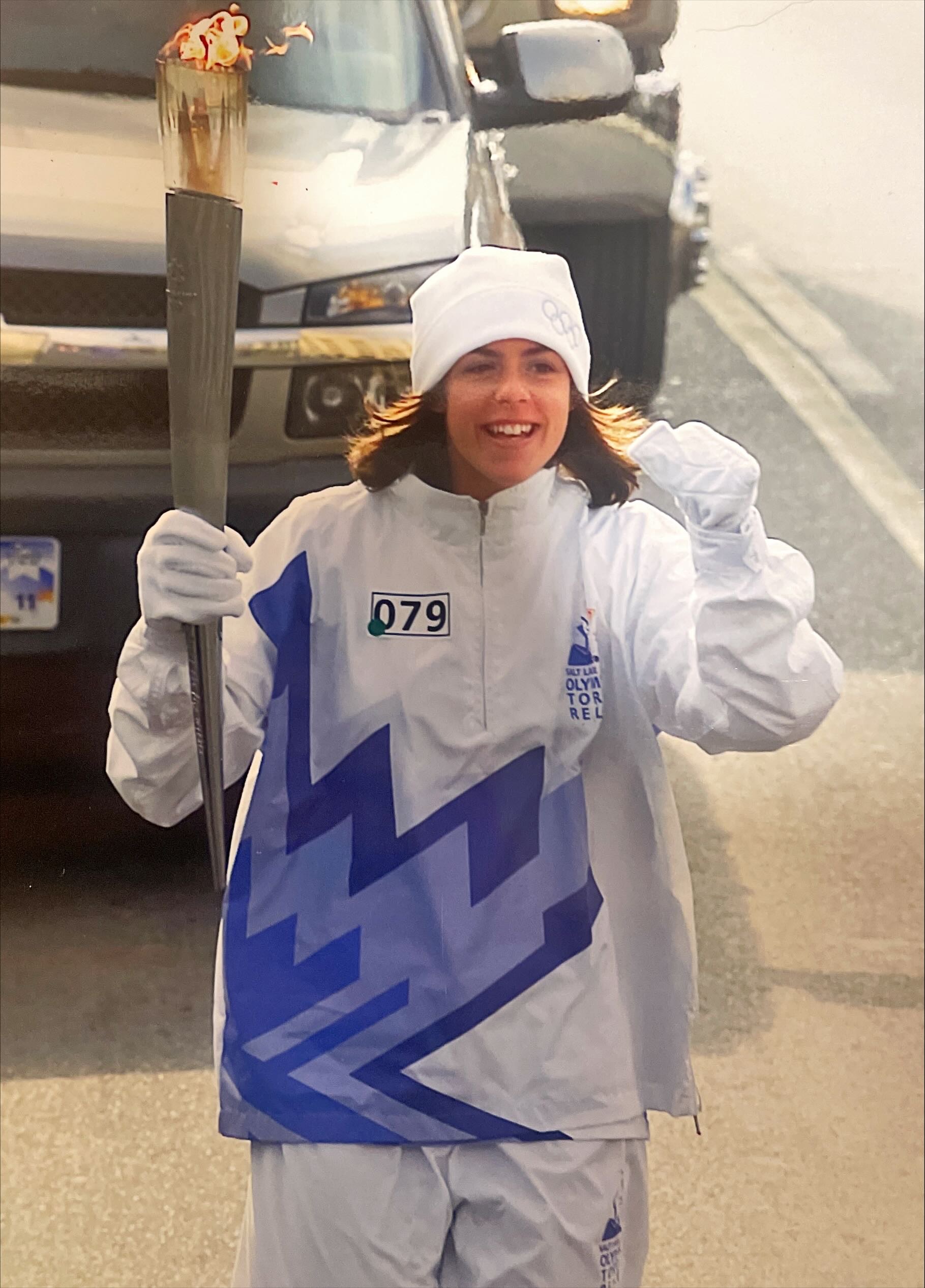 Dr. Jessica Hupe carries an Olympic torch